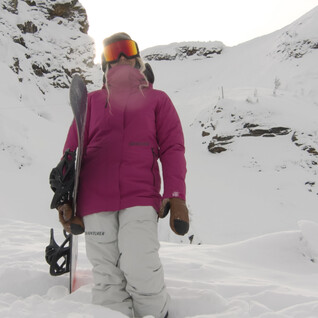 girl standing on snowy mountain advanturer
